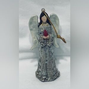 Angel with Bird Ornament cream.4-3/4”L X 2”W